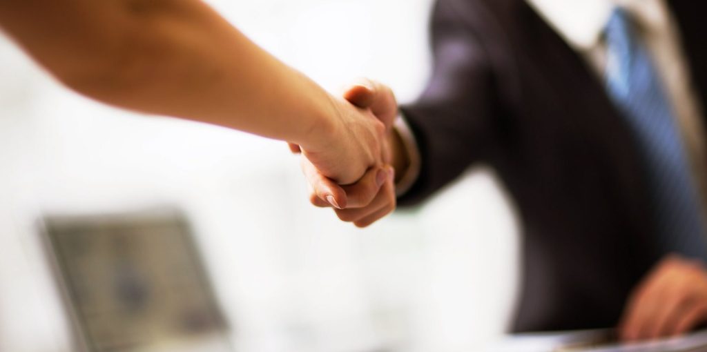 Business people shaking hands finishing up a meeting
